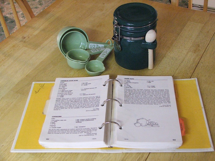 cook books and measuring cup