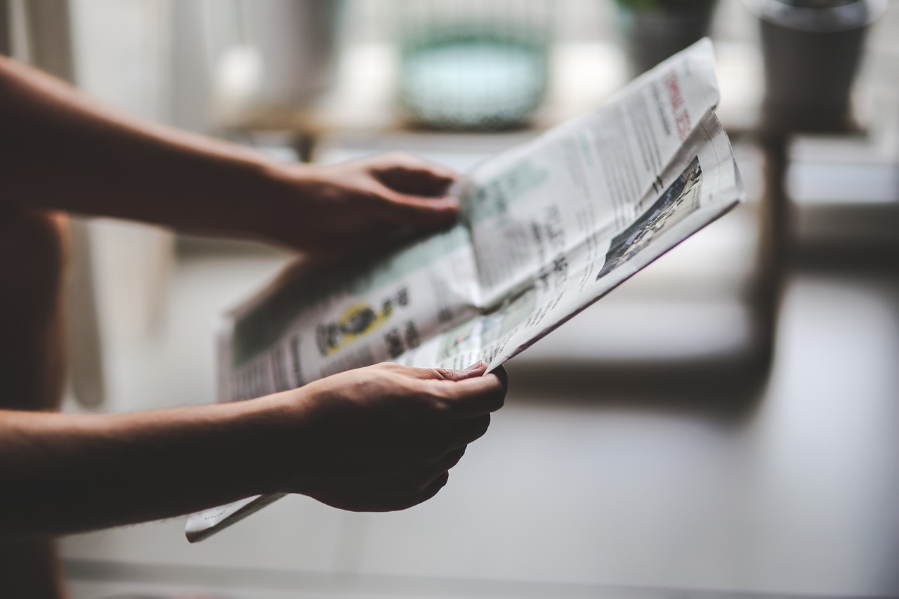 man reading newspaper