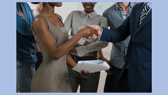 group of people - two are shaking hands