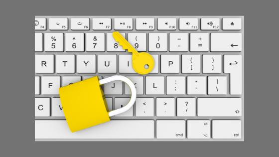 computer keyboard with padlock and key