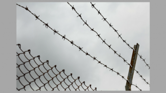 barbed wire and high fence