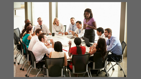 people around a table having a meeting